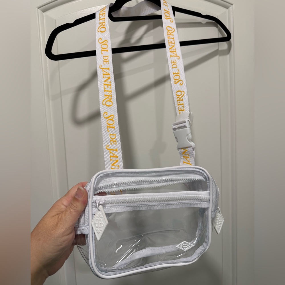 Brand New Sol de Janeiro Transparent Bag with White and Yellow Accents.